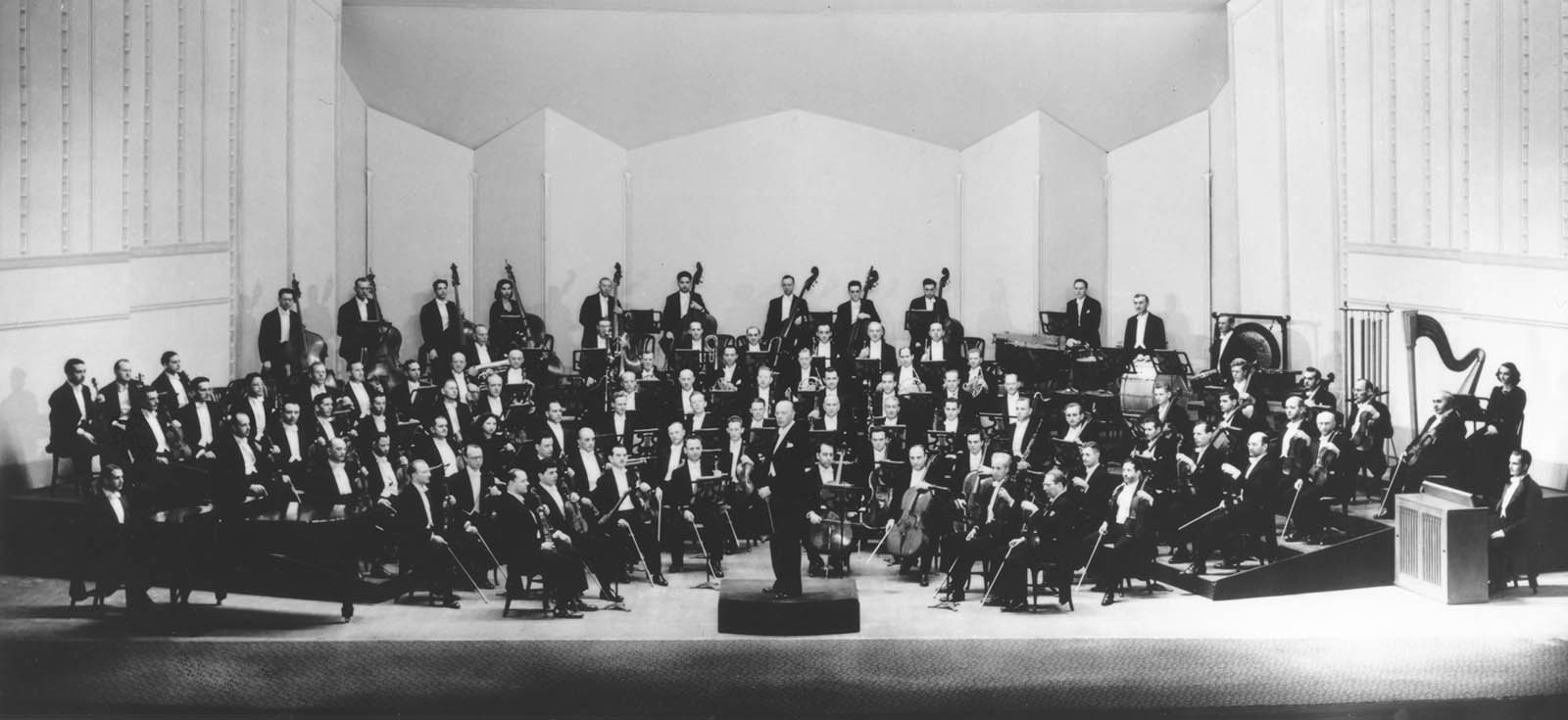 The Cleveland Orchestra and Director George Szell pose in Severance Hall. Unknown photographer, 1946. 