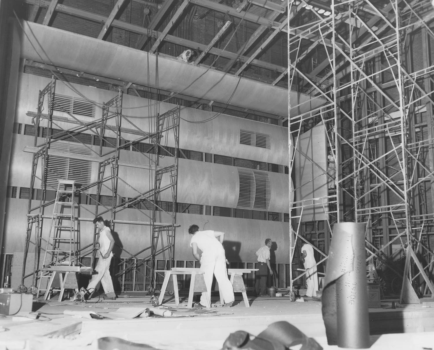 Construction workers on Severance Hall stage during 1958 renovations. Unknown photographer, 1958. 