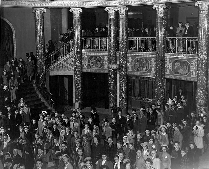 Students and teachers filling the Richard J. Bogomolny and Patricia M. Kozerefski Grand Foyer while waiting for the next education concert, 1947