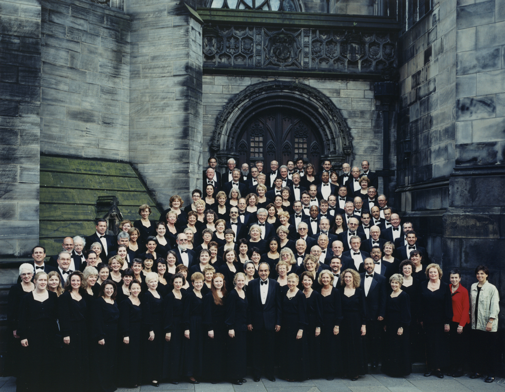 A posed picture of the Cleveland Orchestra Chorus with Porco (front-center) on their Edinburgh Tour – 2000