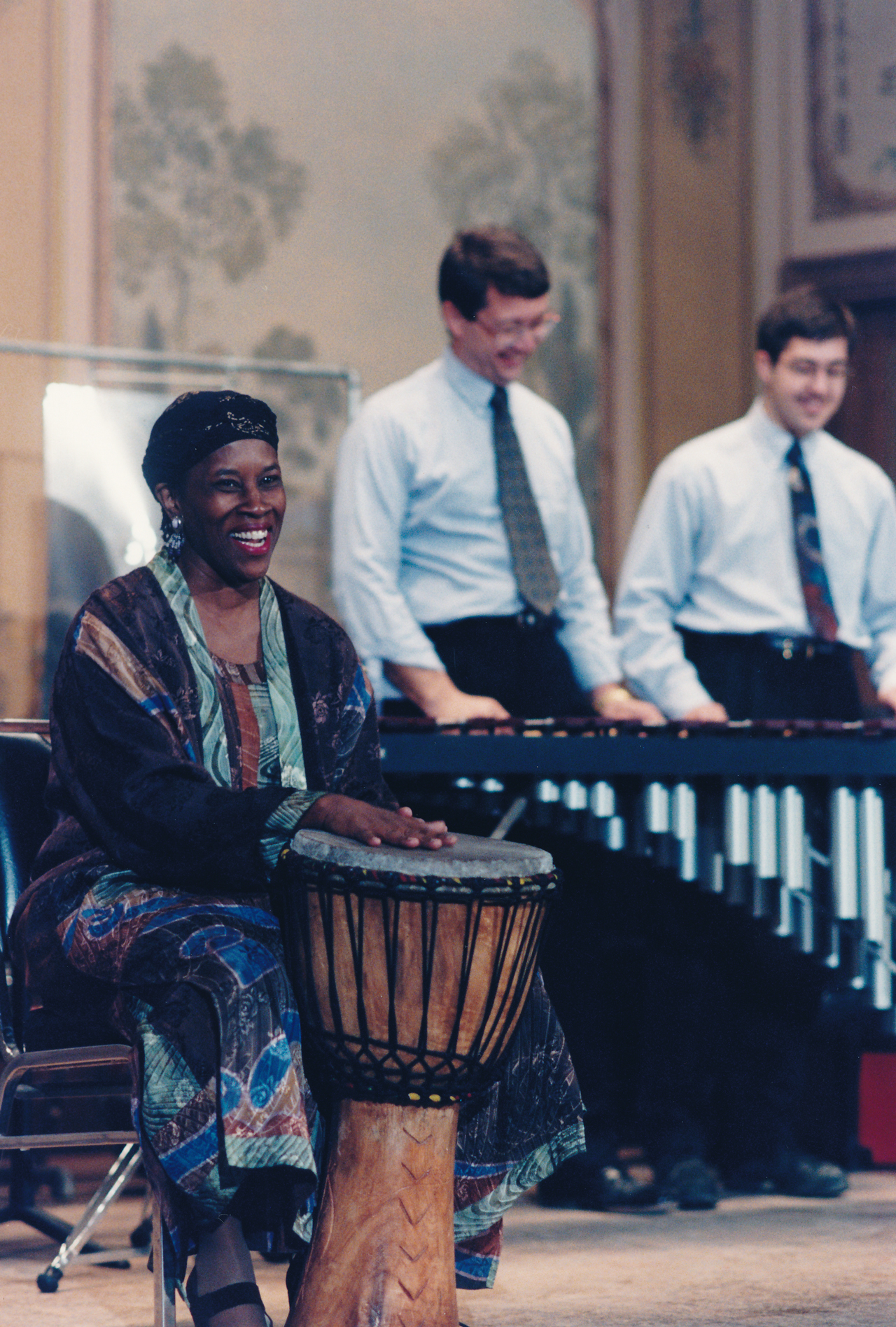 Percussionists share a laugh during a Kwanzaa Musical Rainbow concert in 1998